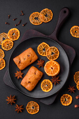 Delicious chocolate muffins and dried round shaped slices of tangerine