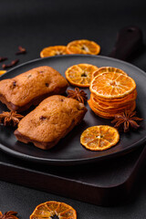 Delicious chocolate muffins and dried round shaped slices of tangerine