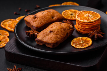 Delicious chocolate muffins and dried round shaped slices of tangerine