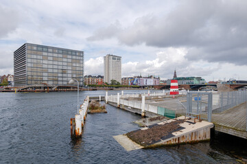 Outdoor scenery of floating bird nest beside Havnebadet Islands Brygge and background of waterfront...