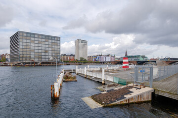 Fototapeta premium Outdoor scenery of floating bird nest beside Havnebadet Islands Brygge and background of waterfront of Marriott hotel in Copenhagen, Denmark. 