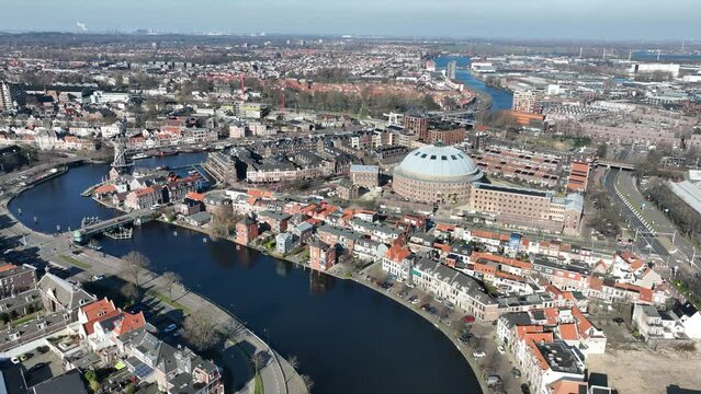 Discover the stunning beauty of Haarlem from above with this mesmerizing drone video, showcasing the former Koepelgevangenis, Molen De Adriaan, and city center.