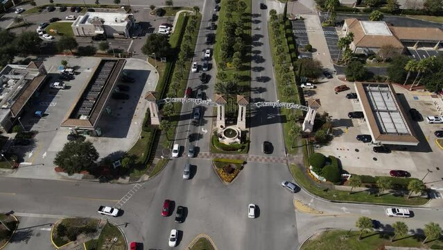 Drone flies towards the Champions Gate sign.