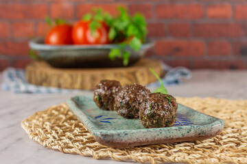 Meat balls or kofta as we call it in Egypt. 
Balls made with minced meat and different spices. 