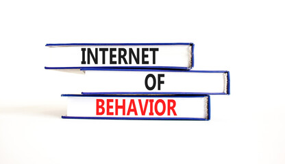 Internet of behavior symbol. Concept words Internet of behavior on books on a beautiful white table white background. Business Internet of behavior concept. Copy space.