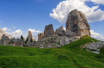 Cinque Torri Dolomites against blue cloudy sky, in Summer. Discover the beauty of the Italian Dolomites