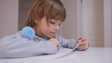 Smart Young Caucasian Girl Preshooler Doing Math Homework Counting Numbers with Her Fingers