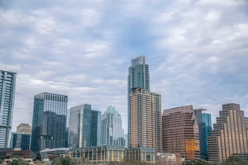 Foto op Plexiglas Austin, Texas cityscape against the cloudy sky background. Facade of residential and business skyscrapers with reflective glass exterior. © Jason