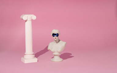 Creative art, minimal layout with a bust of venus with skiing glasses on a pink background