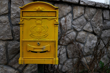Old yellow mailbox in Montenegro