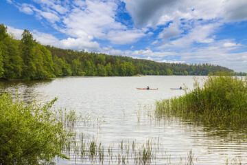Beautiful view of two canoes on lake on beautiful bright day. Sweden. Europe. 