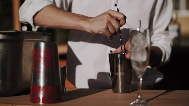 bartender on the street prepares cocktails