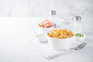 Funchosa with shrimp and vegetables in a plate Pad Thai