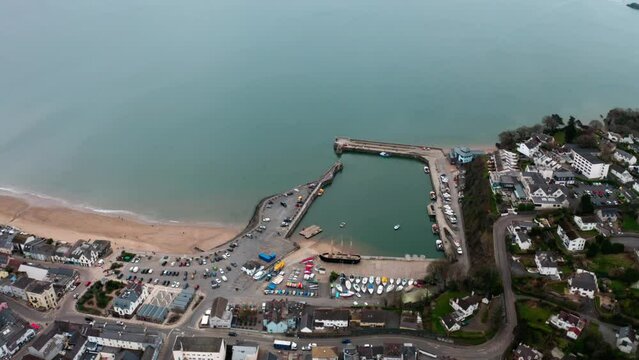 4k Aerial view of saundersfoot during winter months of the year 2023, Aerial view of harbour and beach with high tide