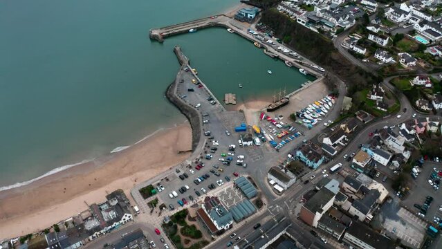4k Aerial view of saundersfoot during winter months of the year 2023, Aerial view of harbour and beach with high tide