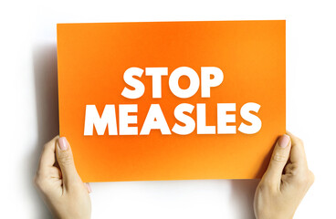 Stop Measles - get the measles, mumps, and rubella (MMR) vaccine, text concept on card