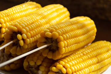 Sweet boiled corn on a stick