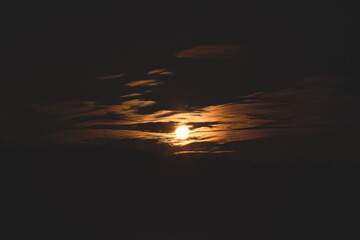 The sun as it sets in Ontario, Canada. A close-up image of the sun. Astrophotography and telephoto image of planets and the sun.