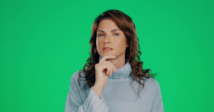 Confused, green screen chromakey and face of a woman thinking isolated on a studio background. Doubt, decision and a portrait of a lady with a thought, contemplation and puzzled on a backdrop