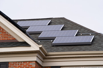 Fototapeta premium solar panels on roof of the house renewable energy green power photovoltaic