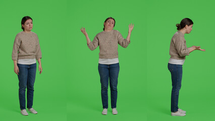 Upset frustrated woman acting angry on full body greenscreen, showing disagreement and disapproval...