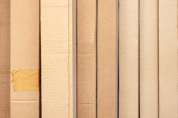 Cardboard boxes in a row, brown cardboard packaging