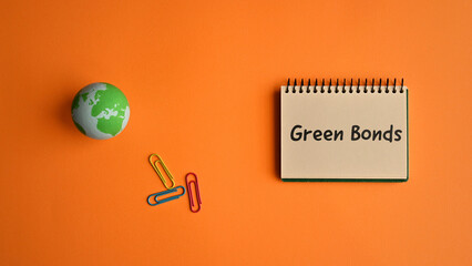 There is a notebook with the word Green Bonds. It is eye-catching image.
