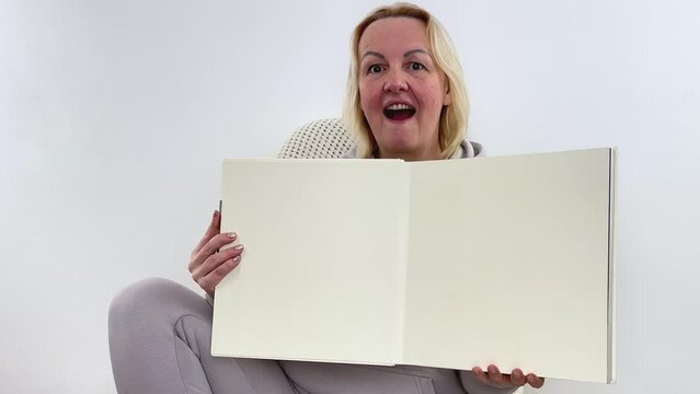 Flat lay stationery as woman working place, work or blogging, New Year ideas, planning and setting goals for next year pretty cheerful lady arms hold book look empty space toothy smile isolated 