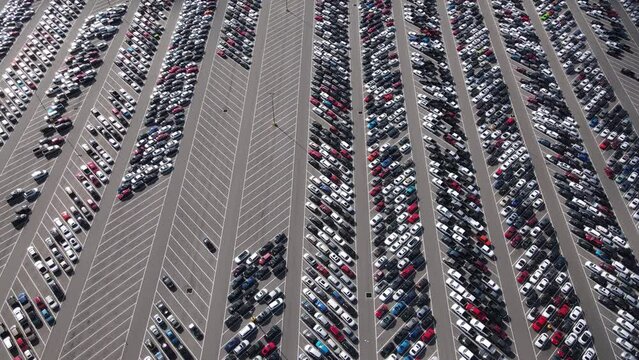 Aerial view of a parking lot full of used cars.