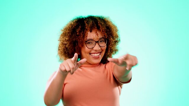 Motivation, happy and portrait of a woman with finger guns isolated on a blue background in studio. Proud, greeting and girl with a gesture for empowerment, confidence and pointing on a backdrop