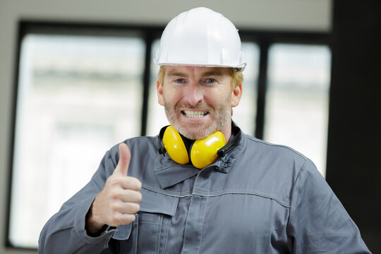 construction site engineer showing thumb-up