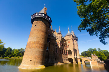 Fototapeta premium Picturesque summer landscape with a view of the ancient Castle De Haar, located near the city of Utrecht, Netherlands