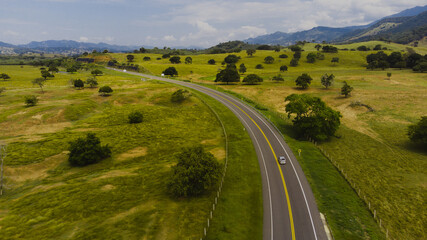 car in the road to the mountains