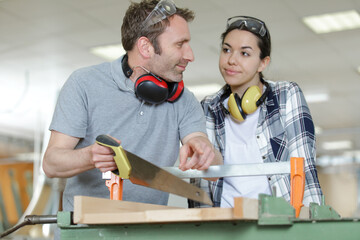 couple of carpenters in a workshop