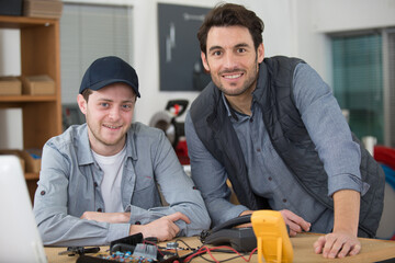 happy electricians looking at the camera