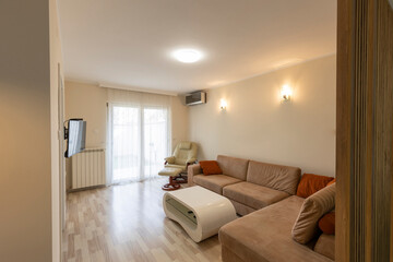 Fototapeta na wymiar Interior of an apartment living room with furniture