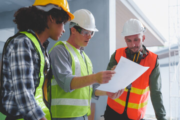 Group of multi ethnic engineer construction site worker meeting at workplace, Architects working together at construction site to remodeling home or building.