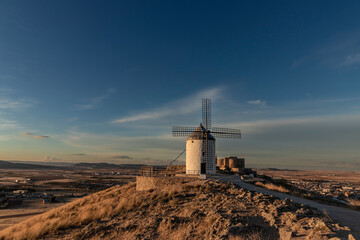 Windmills of Consuegra: A Glimpse of La Mancha's Rustic Charm and Don Quixote's Legendary Quest Amidst a Scenic Landscape of Wind Power Generators