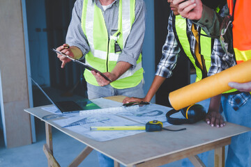 Group of multi ethnic engineer construction site worker meeting at workplace, Architects working together at construction site to remodeling home or building.