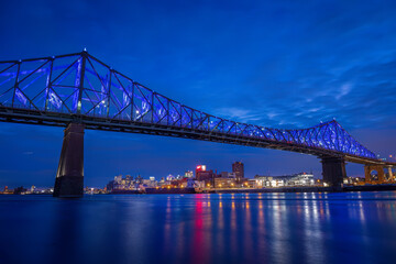 Fototapeta na wymiar Montreal, the Jacques Cartier Bridge was the first in the world to be connected, it presents a light show by Moment Factory.