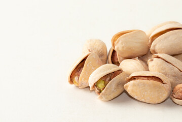 Pistachios nuts isolated on white background close up.