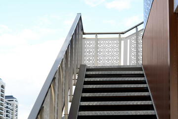 View of metal outdoor stairs with railing