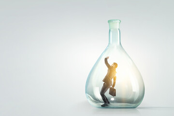 Businessmen scared inside glass bottle