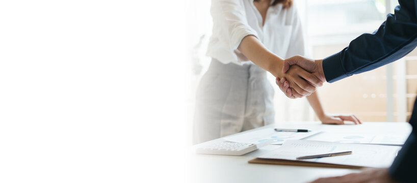 Business partnership concept. Cropped image of two businessmen handshake.