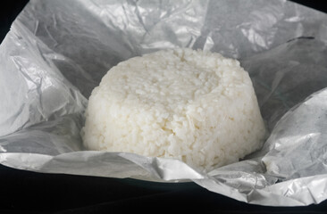 white rice on white paper isolated on a black background