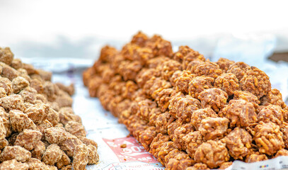 Sugar from sugar cane piles up on a street vendor cart in Sarnath, India.