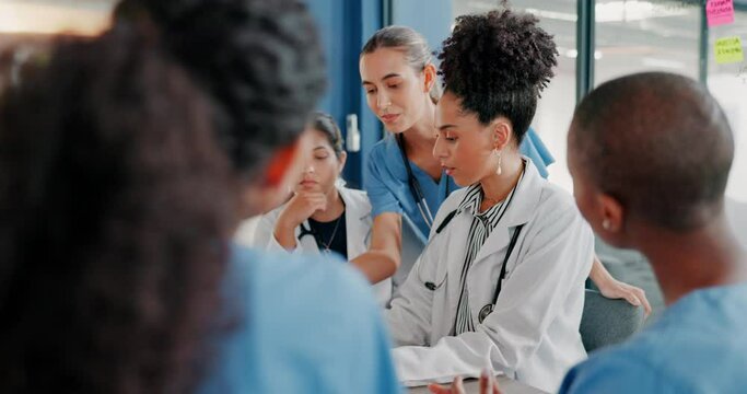 Doctors, nurse or women on clipboard in meeting, collaboration or teamwork for hospital planning, medical or surgery schedule. Talking, leadership or healthcare workers on paper in diversity research