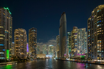 Fototapeta premium Aerial view of downtown district of of Miami Brickell in Florida, USA. Brightly illuminated high skyscraper buildings in modern american midtown