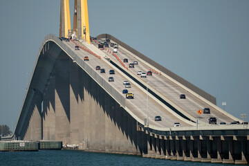 Sunshine Skyway Bridge over Tampa Bay in Florida with moving traffic. Concept of transportation...