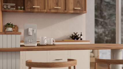 Copy space on a wood kitchen table with a coffee maker in a minimal Scandinavian kitchen © bongkarn